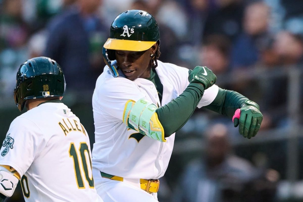 Apr 12, 2024; Oakland, California, USA; Oakland Athletics outfielder Lawrence Butler (4) celebrates with shortstop Nick Allen (10) after hitting a one run home run against the Washington Nationals during the third inning at Oakland-Alameda County Coliseum.