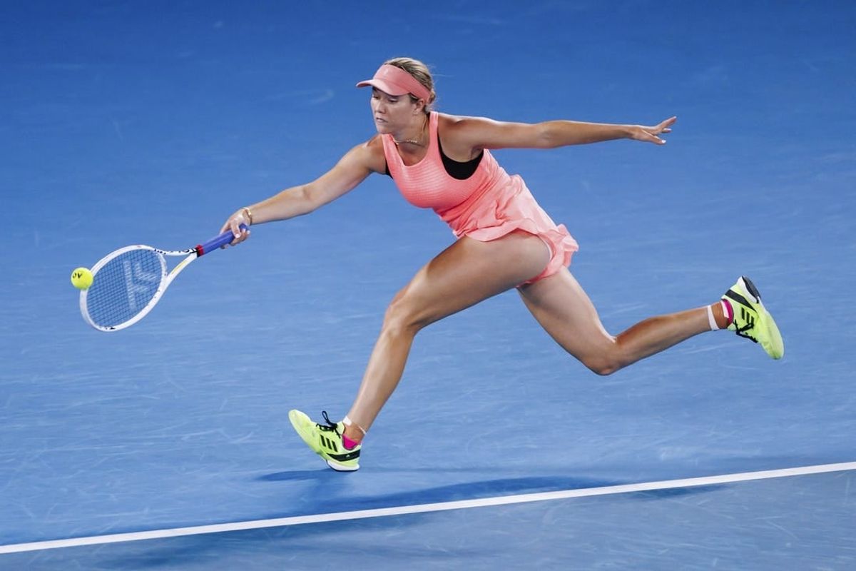 Jan 18, 2024; Melbourne, Victoria, Australia; Danielle Collins of the United States plays a shot against Iga Swiatek (not pictured) of Poland in Round 2 of the Women's Singles on Day 5 of the Australian Open tennis at Rod Laver Arena.