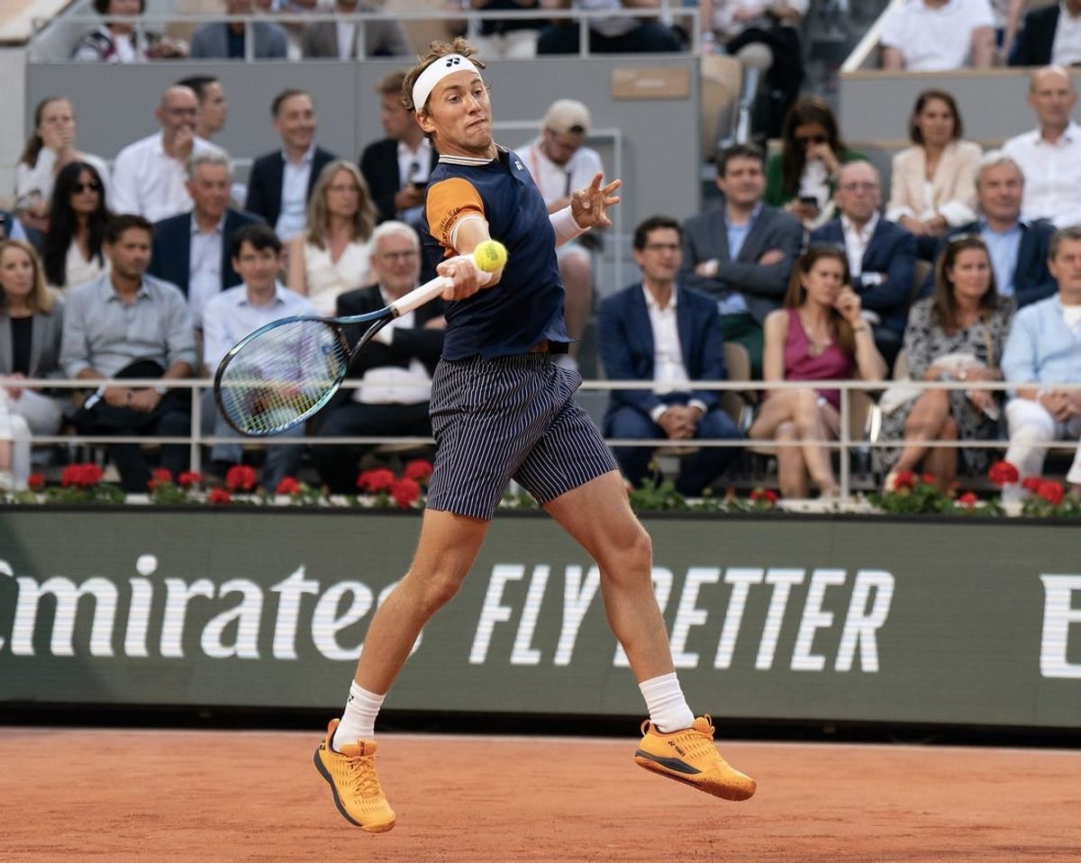 Jun 7 2023; Paris,France; Casper Ruud (NOR) returns a shot during his match against Holger Rune (DEN) on day 11 at Stade Roland-Garros.