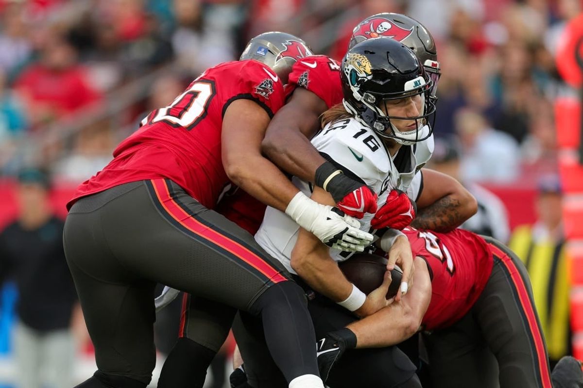 Dec 24, 2023; Tampa, Florida, USA;  Jacksonville Jaguars quarterback Trevor Lawrence (16) is sacked by Tampa Bay Buccaneers linebacker Lavonte David (54) in the second quarter at Raymond James Stadium.