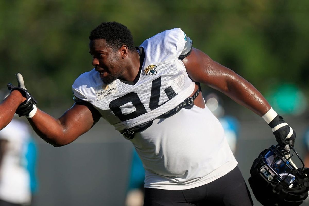 Jacksonville Jaguars defensive tackle Folorunso Fatukasi (94) greets defensive end Dawuane Smoot (91) Dawuane Smoot during training camp Monday, Aug. 7, 2023 at Miller Electric Center at EverBank Stadium in Jacksonville, Fla. This was the 11th day of training camp.