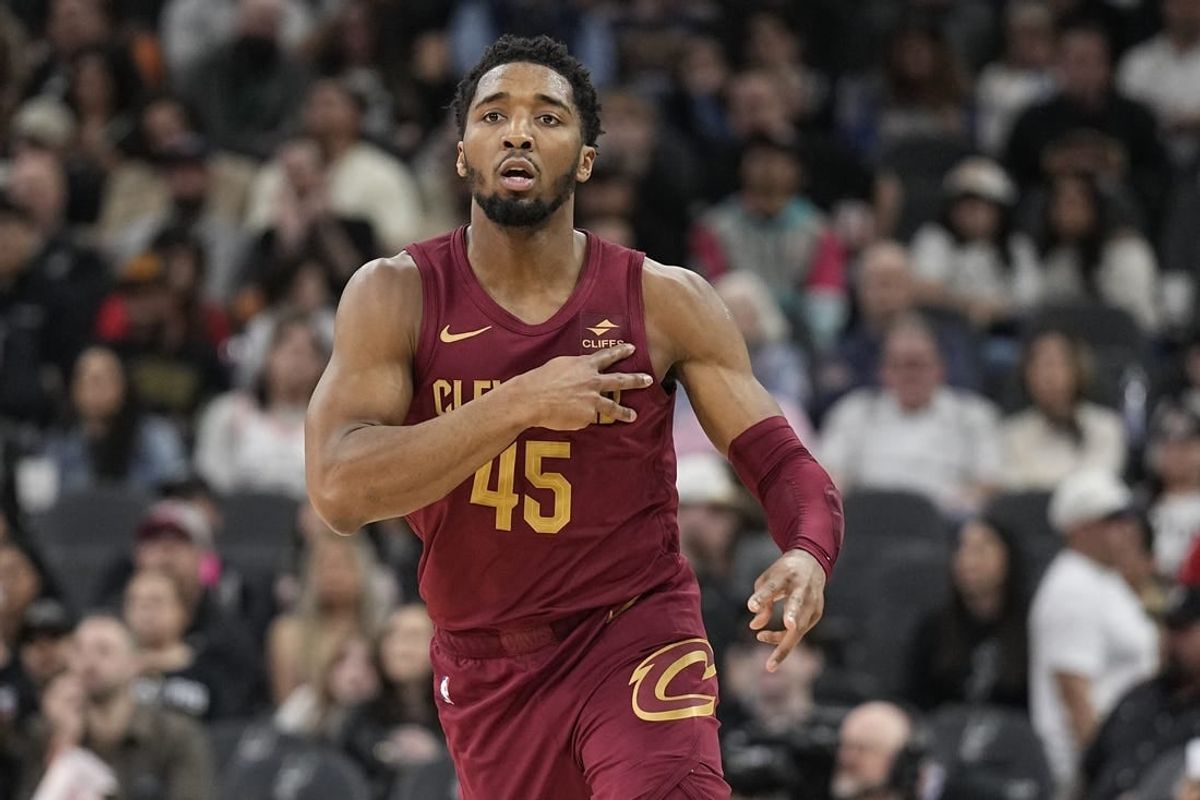 Feb 3, 2024; San Antonio, Texas, USA; cc Cleveland Cavaliers guard Donovan Mitchell (45) reacts after scoring a three point basket during the first half against the San Antonio Spurs at Frost Bank Center.