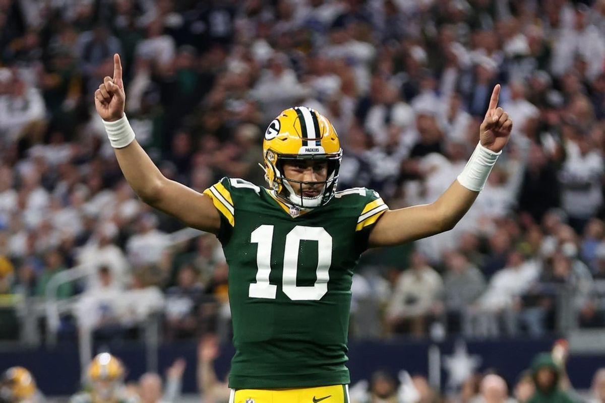 Jan 14, 2024; Arlington, Texas, USA; Green Bay Packers quarterback Jordan Love (10) reacts after a touchdown against the Dallas Cowboys in the first quarter for the 2024 NFC wild card game at AT&T Stadium.