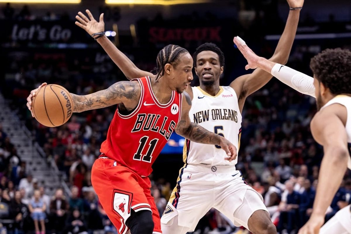 Feb 25, 2024; New Orleans, Louisiana, USA;  Chicago Bulls forward DeMar DeRozan (11) looks to pass the ball against New Orleans Pelicans forward Herbert Jones (5) during the second half at Smoothie King Center.