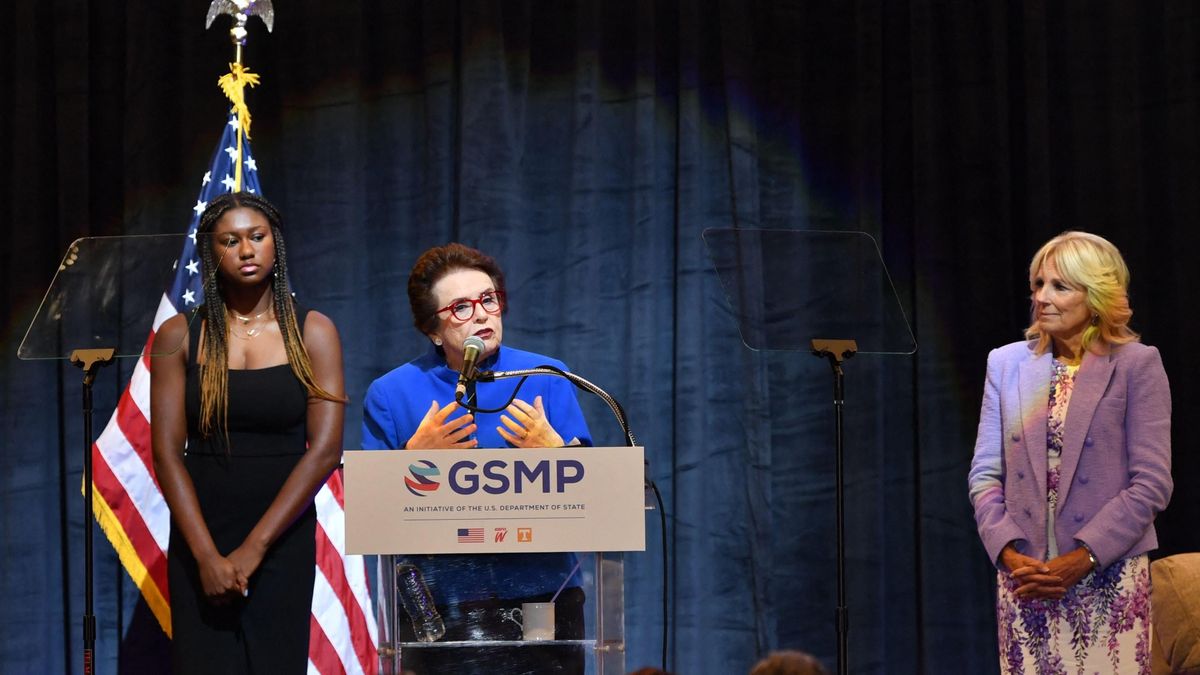 US First Lady Jill Biden (R) and high school track athlete Maya Mosley (L) listen to tennis legend Billie Jean King speak during an event to mark the 50th anniversary of Title IX at Capitol One Arena in Washington, DC, on June 22, 2022.
