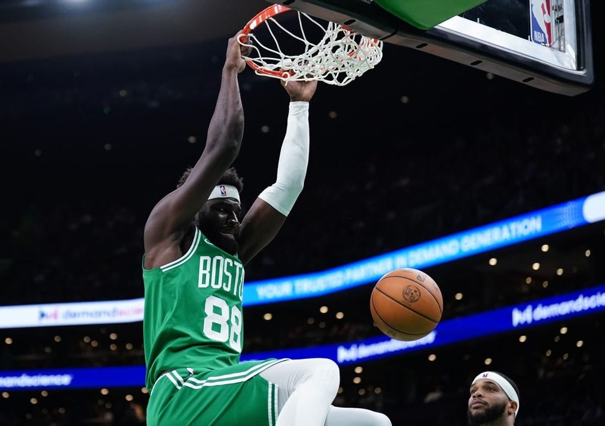 Apr 12, 2024; Boston, Massachusetts, USA; Boston Celtics center Neemias Queta (88) makes the basket against the Charlotte Hornets in the second quarter at TD Garden.