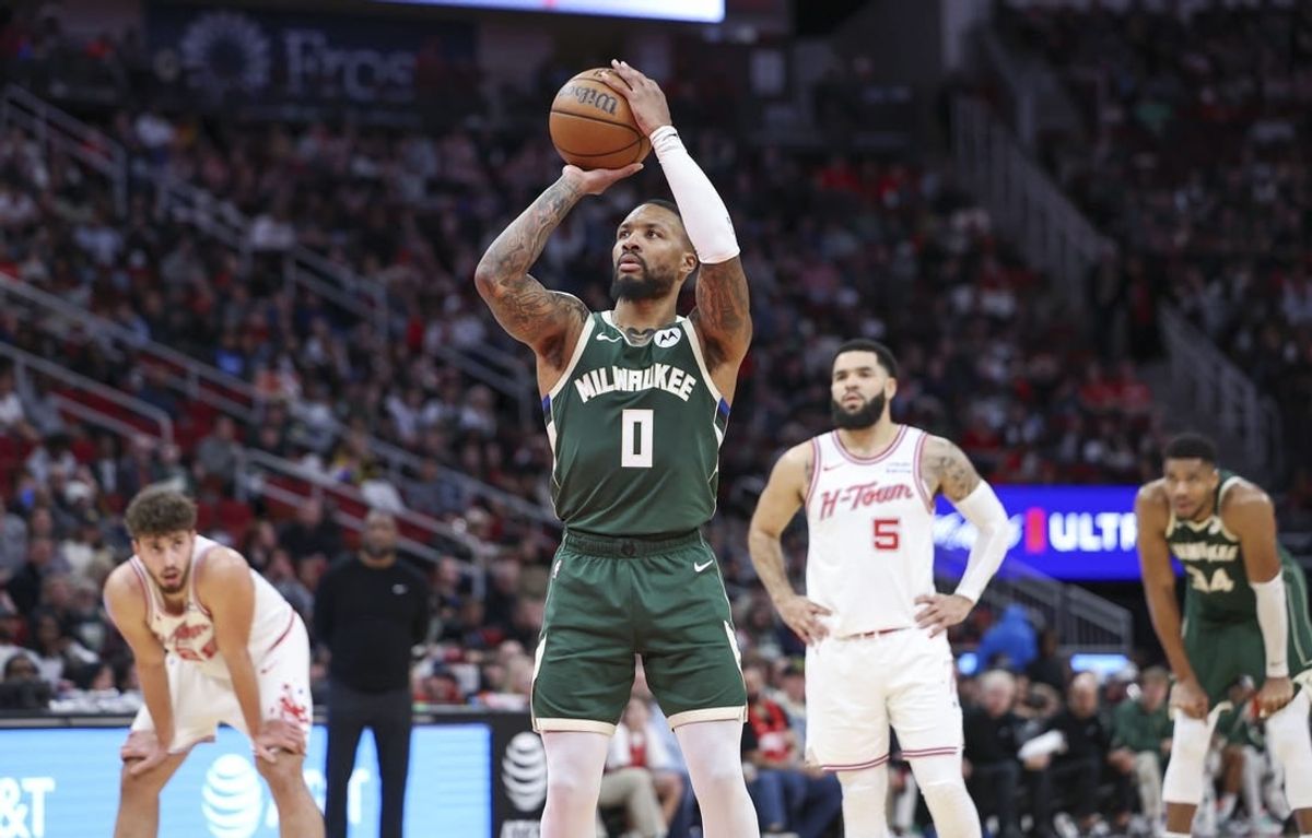 Jan 6, 2024; Houston, Texas, USA; Milwaukee Bucks guard Damian Lillard (0) attempts a free throw during the second quarter against the Houston Rockets at Toyota Center.
