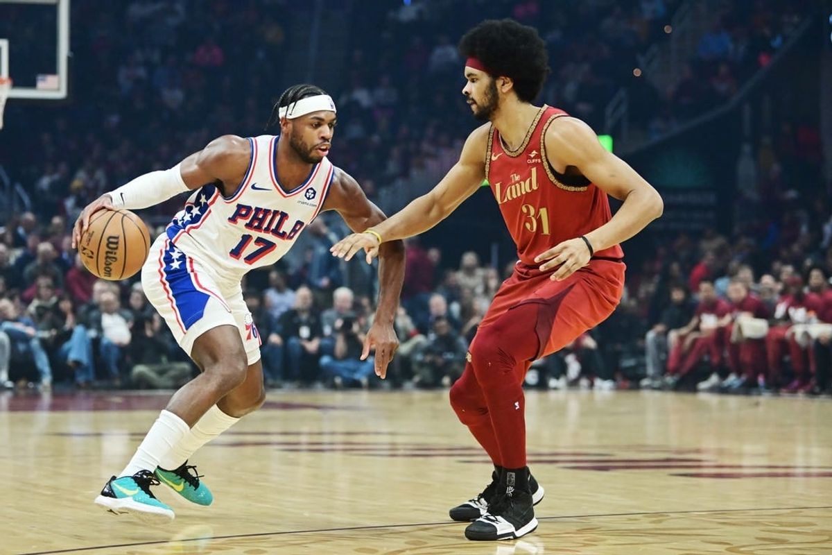 Feb 12, 2024; Cleveland, Ohio, USA; Philadelphia 76ers guard Buddy Hield (17) drives to the basket against Cleveland Cavaliers center Jarrett Allen (31) during the first half at Rocket Mortgage FieldHouse.