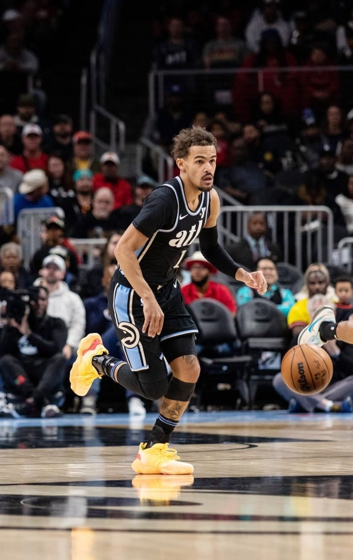 Jan 15, 2024; Atlanta, Georgia, USA; Atlanta Hawks guard Trae Young (11) dribbles down court against San Antonio Spurs during the first quarter at State Farm Arena.