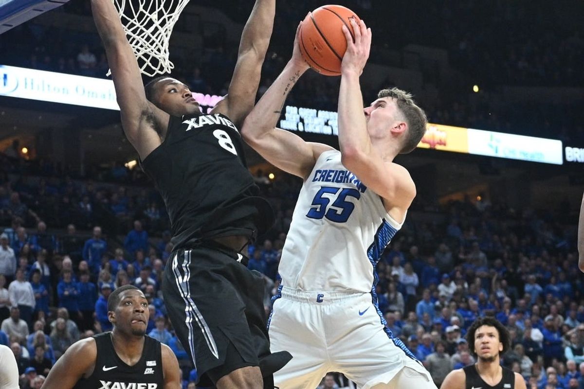 Jan 23, 2024; Omaha, Nebraska, USA;  Creighton Bluejays guard Baylor Scheierman (55) attempts a shot against Xavier Musketeers guard Quincy Olivari (8) in the second half at CHI Health Center Omaha.