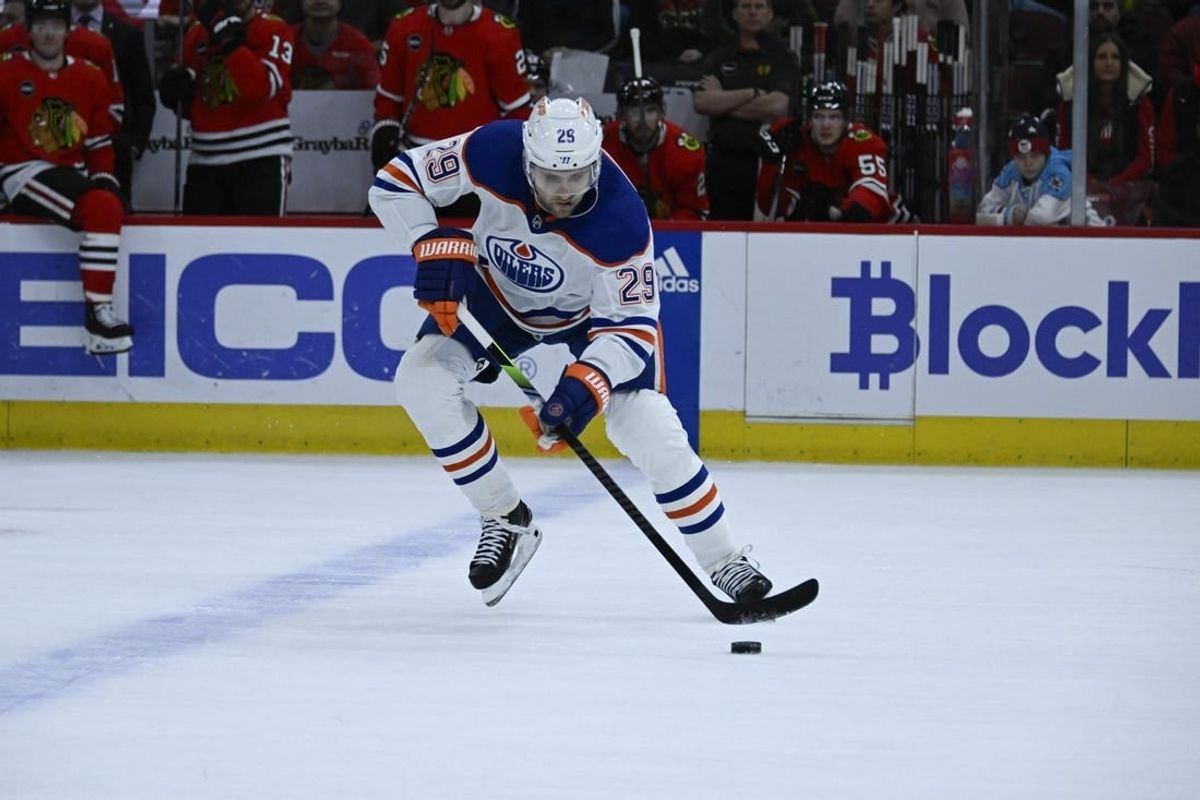Jan 9, 2024; Chicago, Illinois, USA;  Edmonton Oilers center Leon Draisaitl (29) moves the puck against the Chicago Blackhawks during the first period at the United Center.