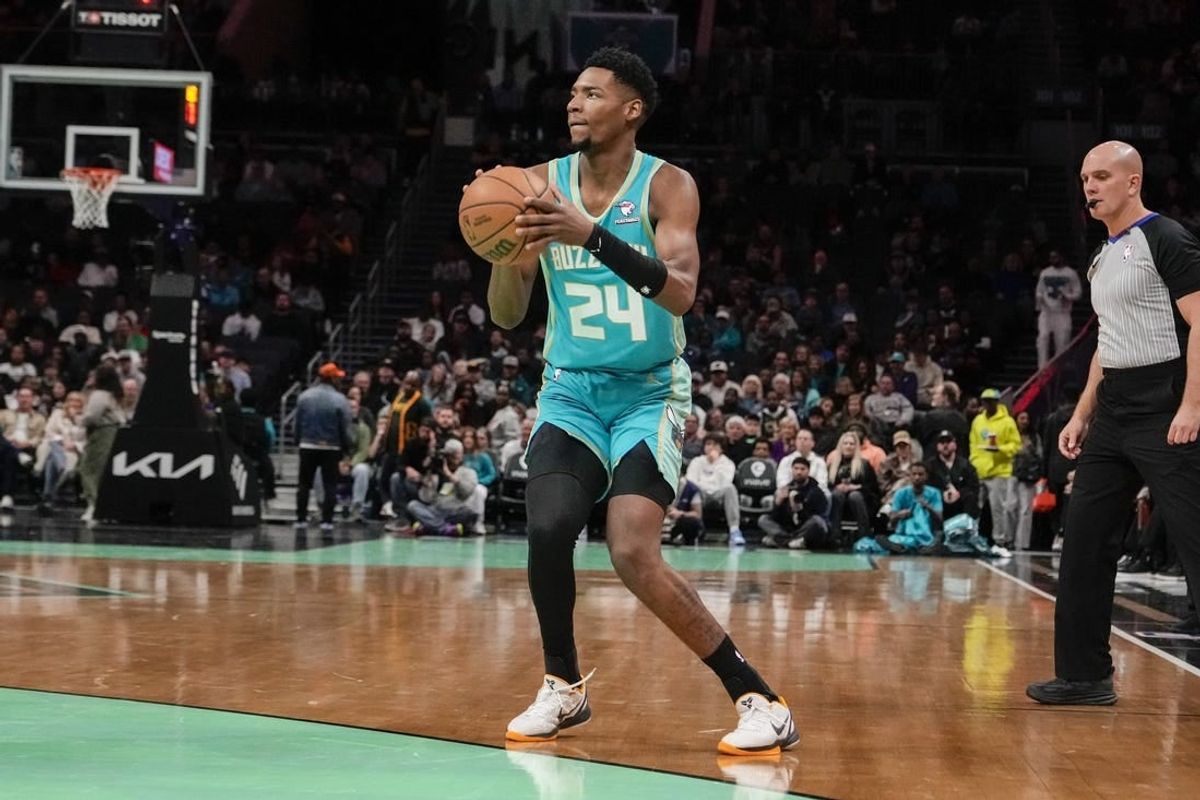 Feb 4, 2024; Charlotte, North Carolina, USA; Charlotte Hornets forward Brandon Miller (24) sets up for a jumper against the Indiana Pacers during the first quarter at Spectrum Center.