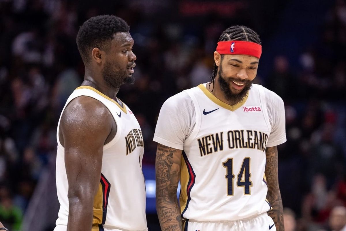 Dec 31, 2023; New Orleans, Louisiana, USA;  New Orleans Pelicans forward Zion Williamson (1) and forward Brandon Ingram (14) share a laugh after a play against the Los Angeles Lakers during the second half at Smoothie King Center.