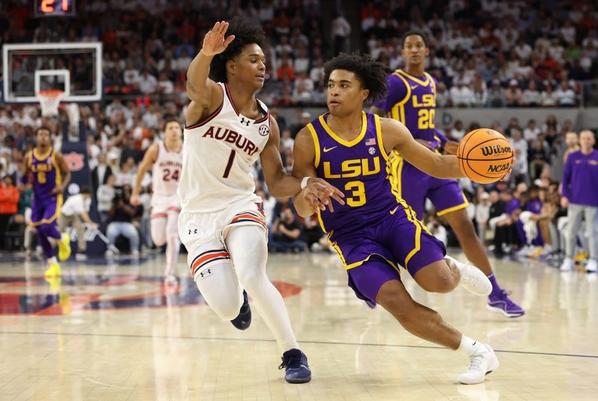 Jan 13, 2024; Auburn, Alabama, USA; Auburn Tigers guard Aden Holloway (1) pressures LSU Tigers guard Jalen Cook (3) during the first half at Neville Arena.
