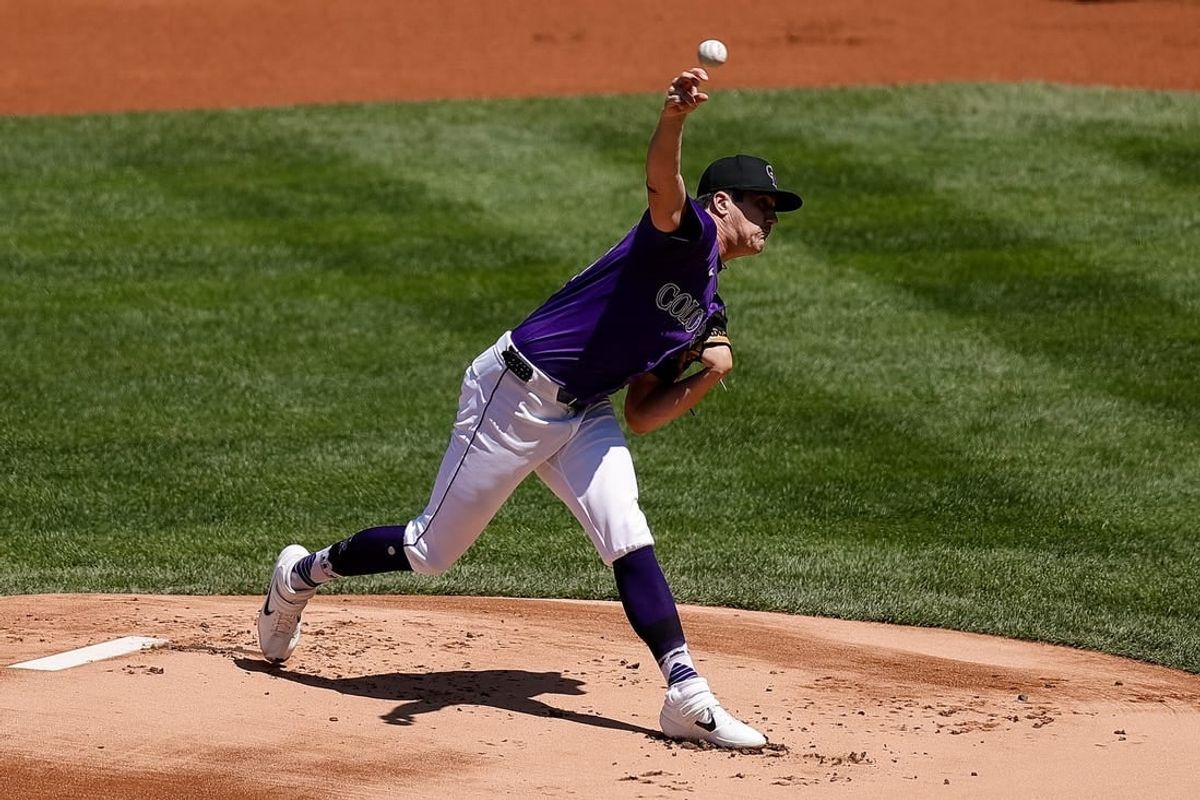 Apr 21, 2024; Denver, Colorado, USA; Colorado Rockies starting pitcher Cal Quantrill (47) pitches in the first inning against the Seattle Mariners at Coors Field.