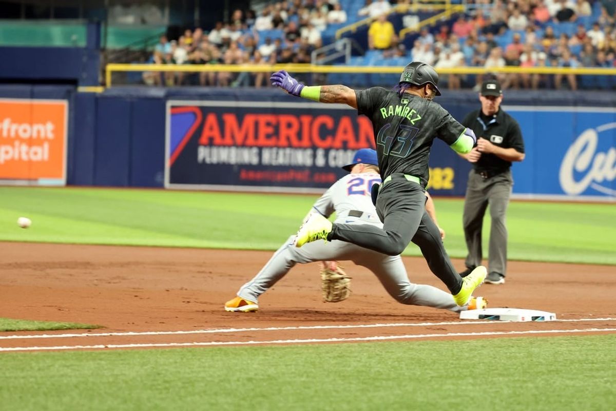 May 3, 2024; St. Petersburg, Florida, USA;  Tampa Bay Rays outfielder Harold Ramírez (43) is safe at first base as New York Mets first base Pete Alonso (20) attempted to tag him out during the first inning at Tropicana Field.