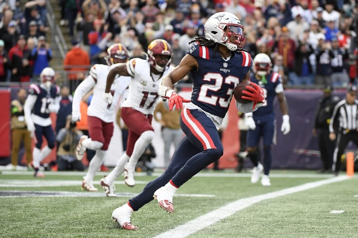 Nov 5, 2023; Foxborough, Massachusetts, USA;  New England Patriots safety Kyle Dugger (23) runs the ball out of the end zone after an interception during the first half against the Washington Commanders at Gillette Stadium.