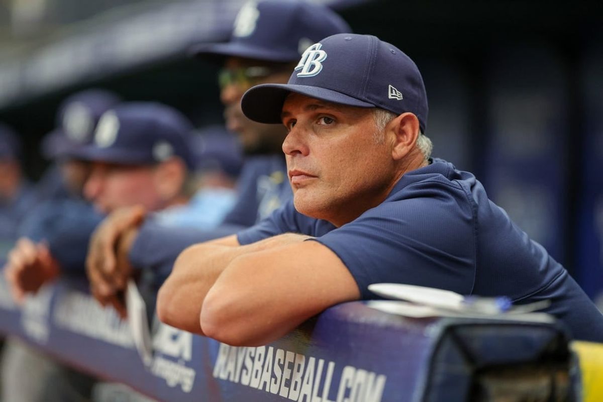 Aug 24, 2023; St. Petersburg, Florida, USA;  Tampa Bay Rays manager Kevin Cash (16) looks on from the dugout against the Colorado Rockies in the third inning at Tropicana Field.