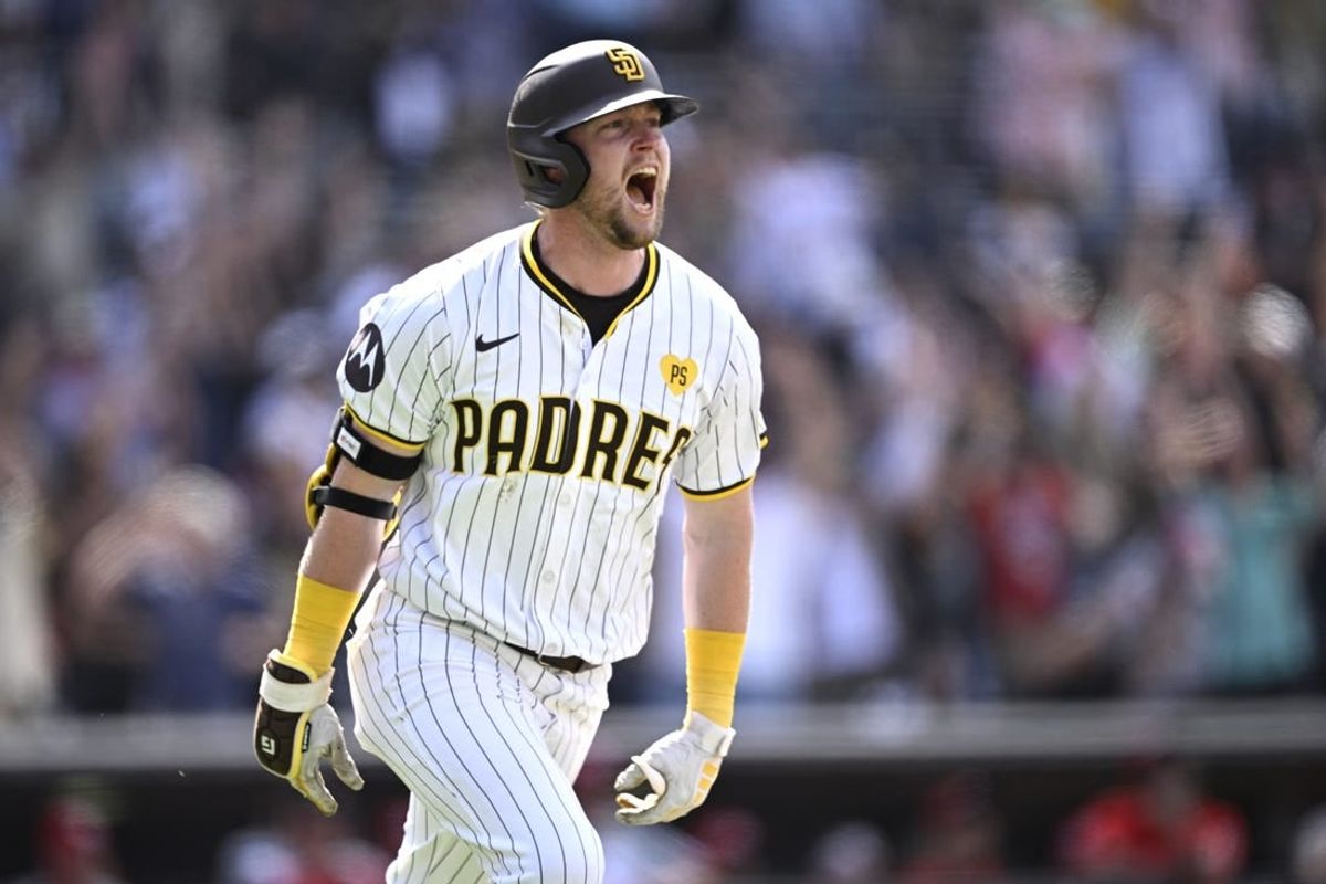 May 1, 2024; San Diego, California, USA; San Diego Padres first baseman Jake Cronenworth (9) celebrates after hitting a grand slam home run against the Cincinnati Reds during the seventh inning at Petco Park.