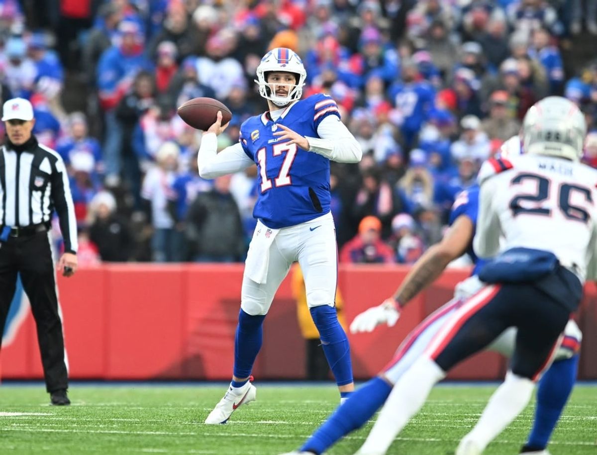 Dec 31, 2023; Orchard Park, New York, USA; Buffalo Bills quarterback Josh Allen (17) throws a pass in the first quarter against the New England Patriots at Highmark Stadium.