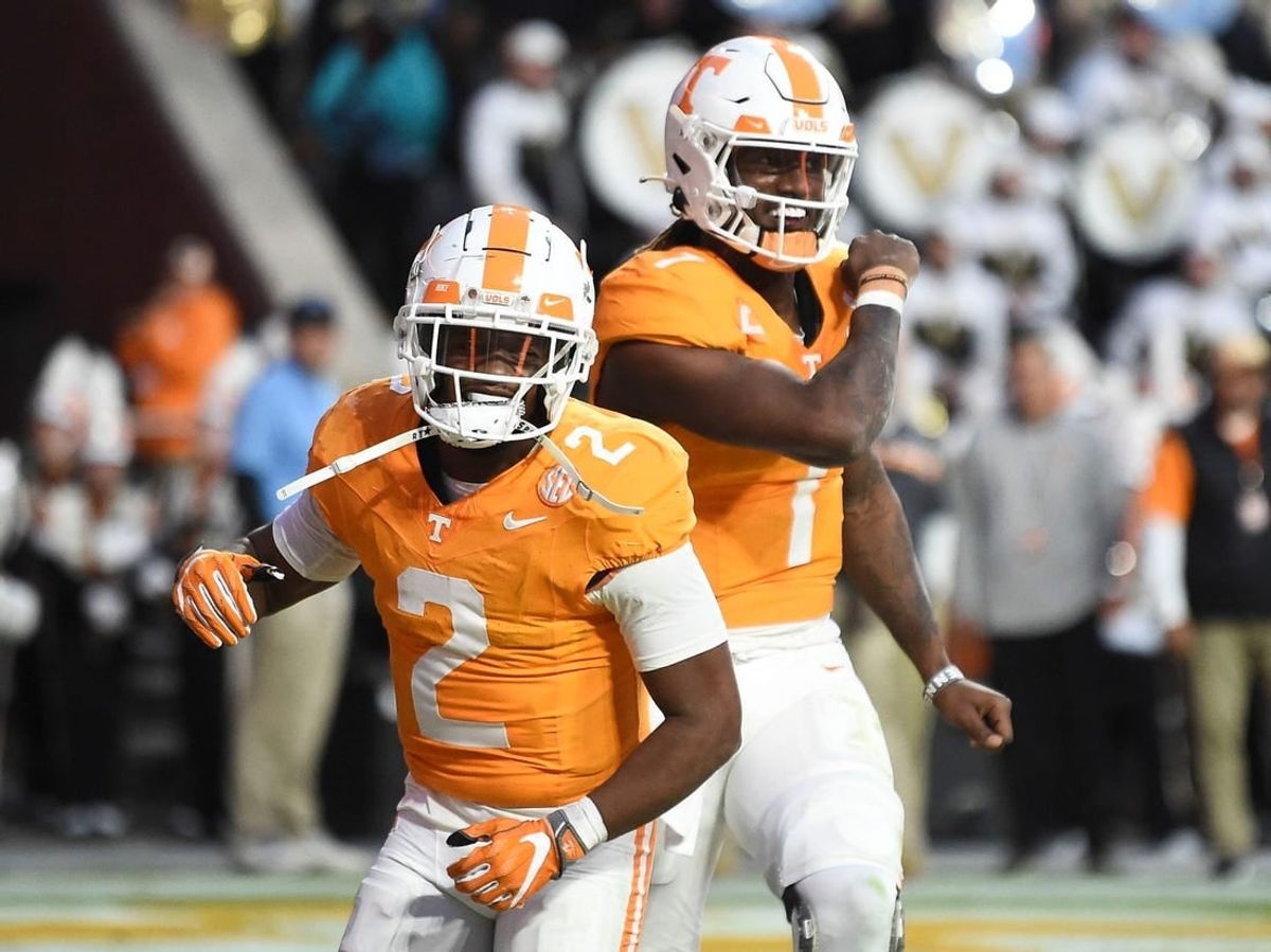 Tennessee quarterback Joe Milton III (7) and Jabari Small (2) celebrate Milton's touchdown during an NCAA college football game against Vanderbilt on Saturday, November 25, 2023 in Knoxville, Tenn.