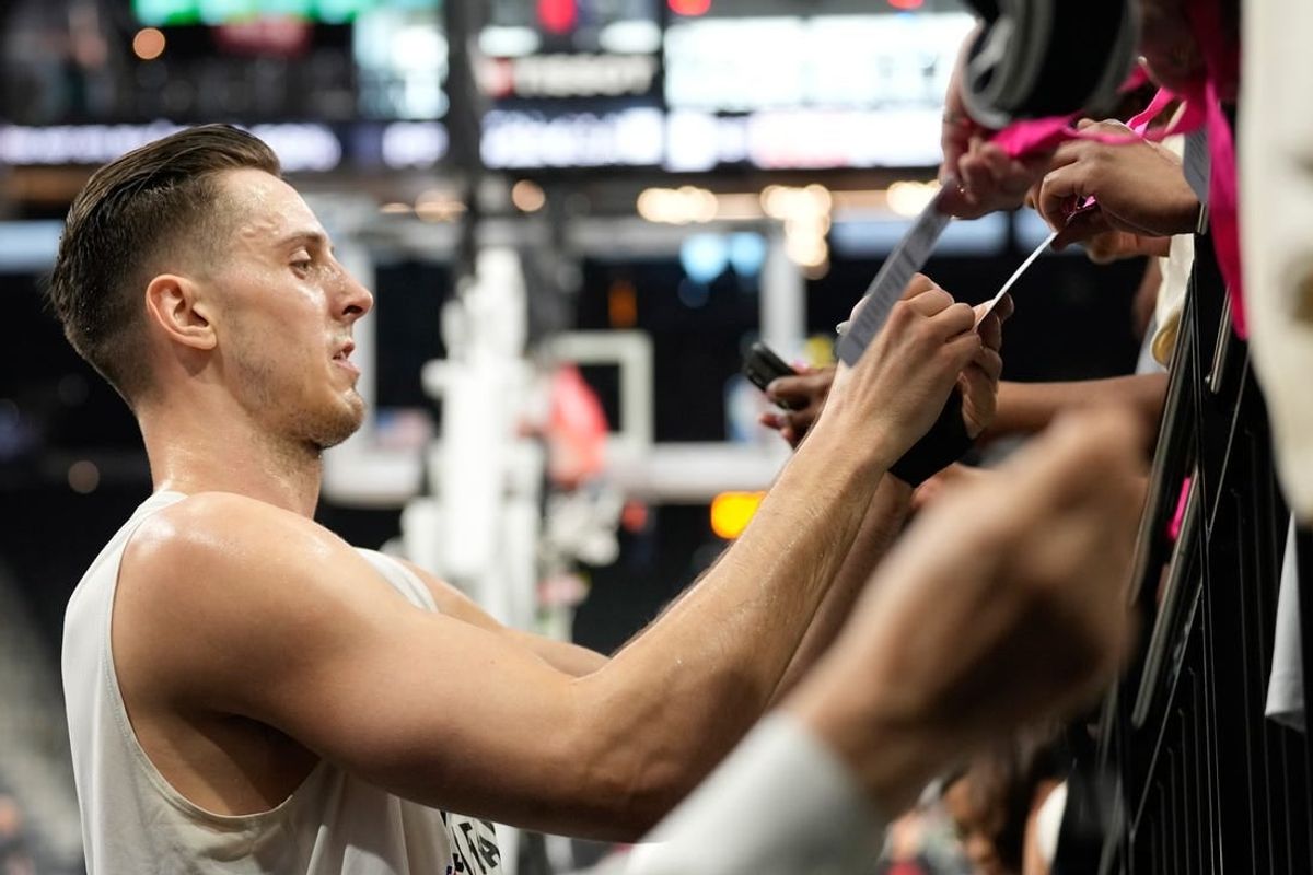 Apr 14, 2024; San Antonio, Texas, USA; San Antonio Spurs center Zach Collins (23) signs autographs before a game against the Detroit Pistons at Frost Bank Center.