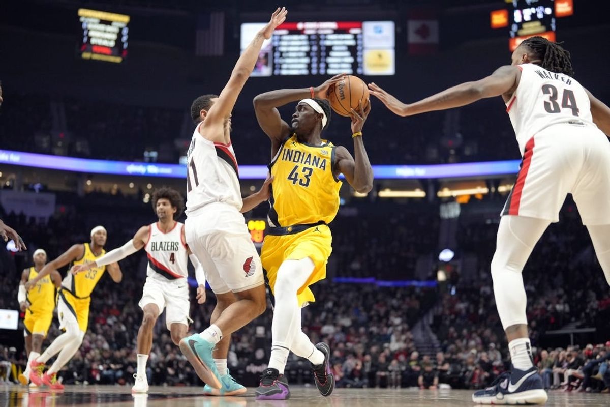 Jan 19, 2024; Portland, Oregon, USA; Indiana Pacers power forward Pascal Siakam (43) looks to pass while defended by Portland Trail Blazers point guard Malcolm Brogdon (11) during the first half at Moda Center.