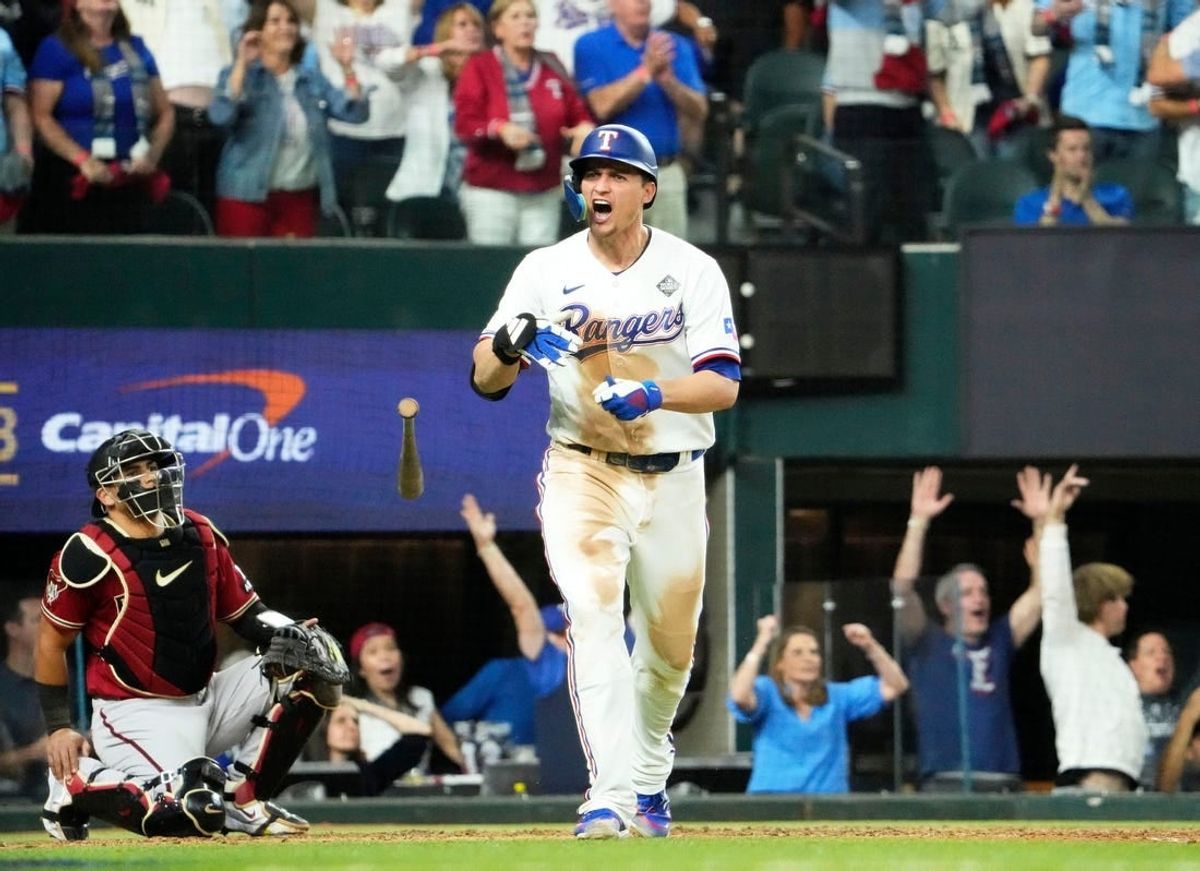 Texas Rangers Corey Seager (5) hits a two-run home run off Arizona Diamondbacks relief pitcher Paul Sewald (38) in the ninth inning during Game 1 of the 2023 World Series at Globe Life Field on Oct 27, 2023.
