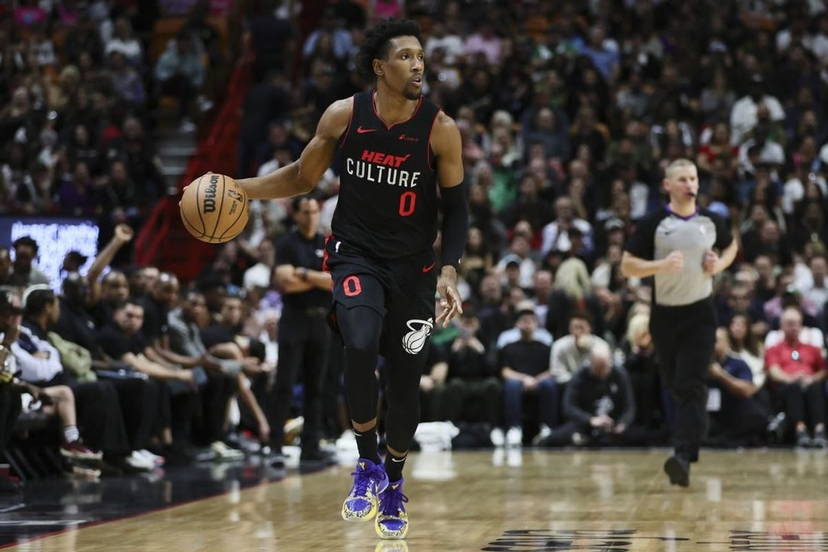 Jan 25, 2024; Miami, Florida, USA; Miami Heat guard Josh Richardson (0) dribbles the basketball against the Boston Celtics during the third quarter at Kaseya Center.