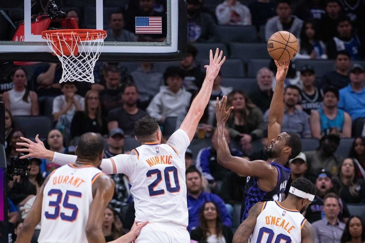 Apr 12, 2024; Sacramento, California, USA; Sacramento Kings forward Harrison Barnes (40) puts up a shot over Phoenix Suns center Jusuf Nurkic (20) during the first quarter at Golden 1 Center.