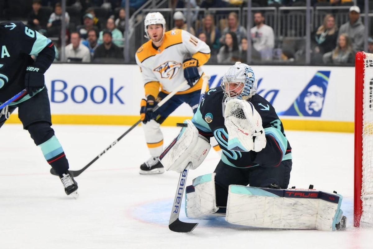 Mar 16, 2024; Seattle, Washington, USA; Seattle Kraken goaltender Philipp Grubauer (31) blocks a goal shot against the Nashville Predators during the first period at Climate Pledge Arena.