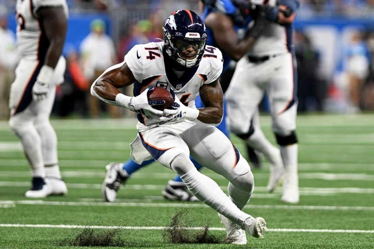 Dec 16, 2023; Detroit, Michigan, USA; Denver Broncos wide receiver Courtland Sutton (14) runs with the ball against the Detroit Lions in the third quarter at Ford Field.