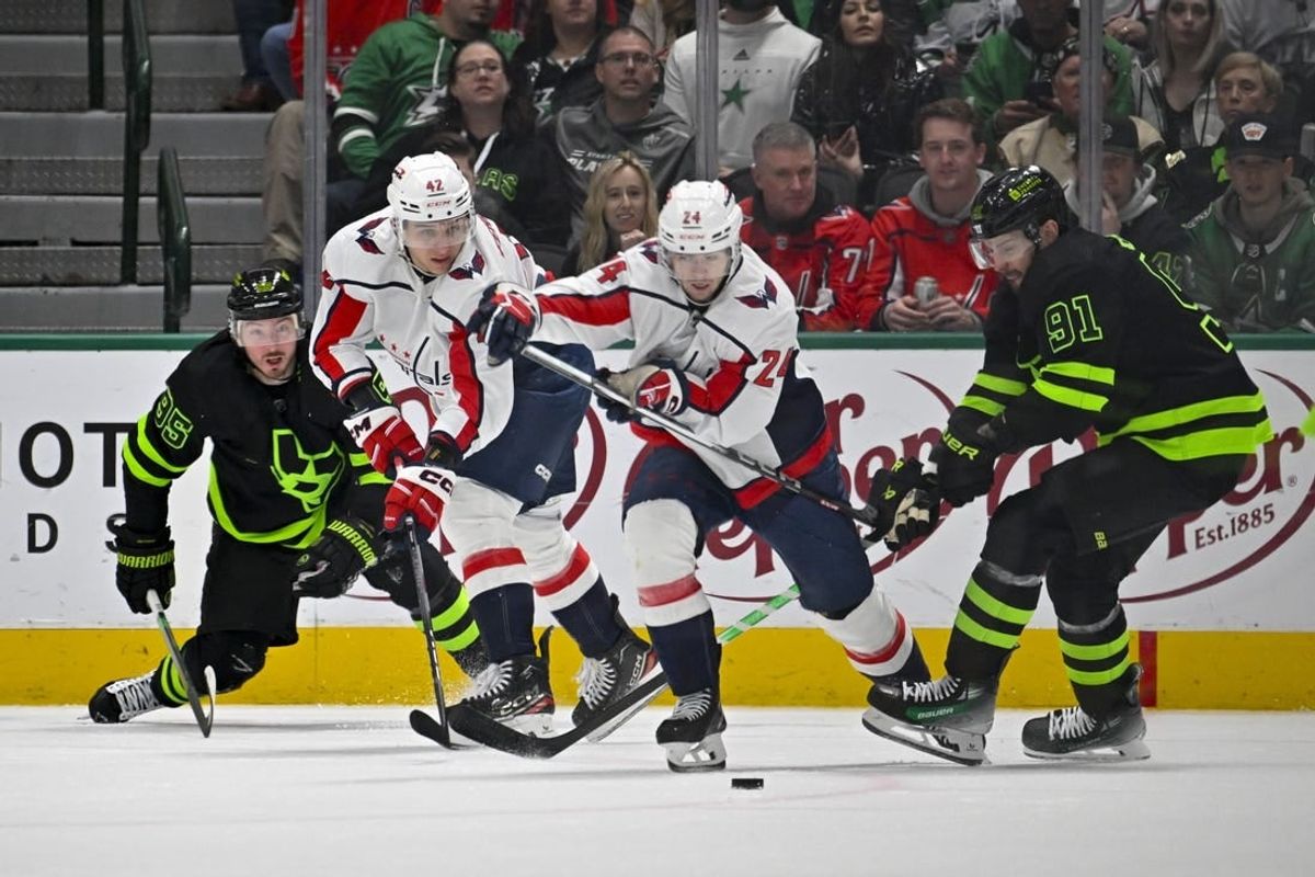 Jan 27, 2024; Dallas, Texas, USA; Dallas Stars center Matt Duchene (95) and center Tyler Seguin (91) and Washington Capitals defenseman Martin Fehervary (42) and center Connor McMichael (24) chase the puck during the first period at the American Airlines Center.