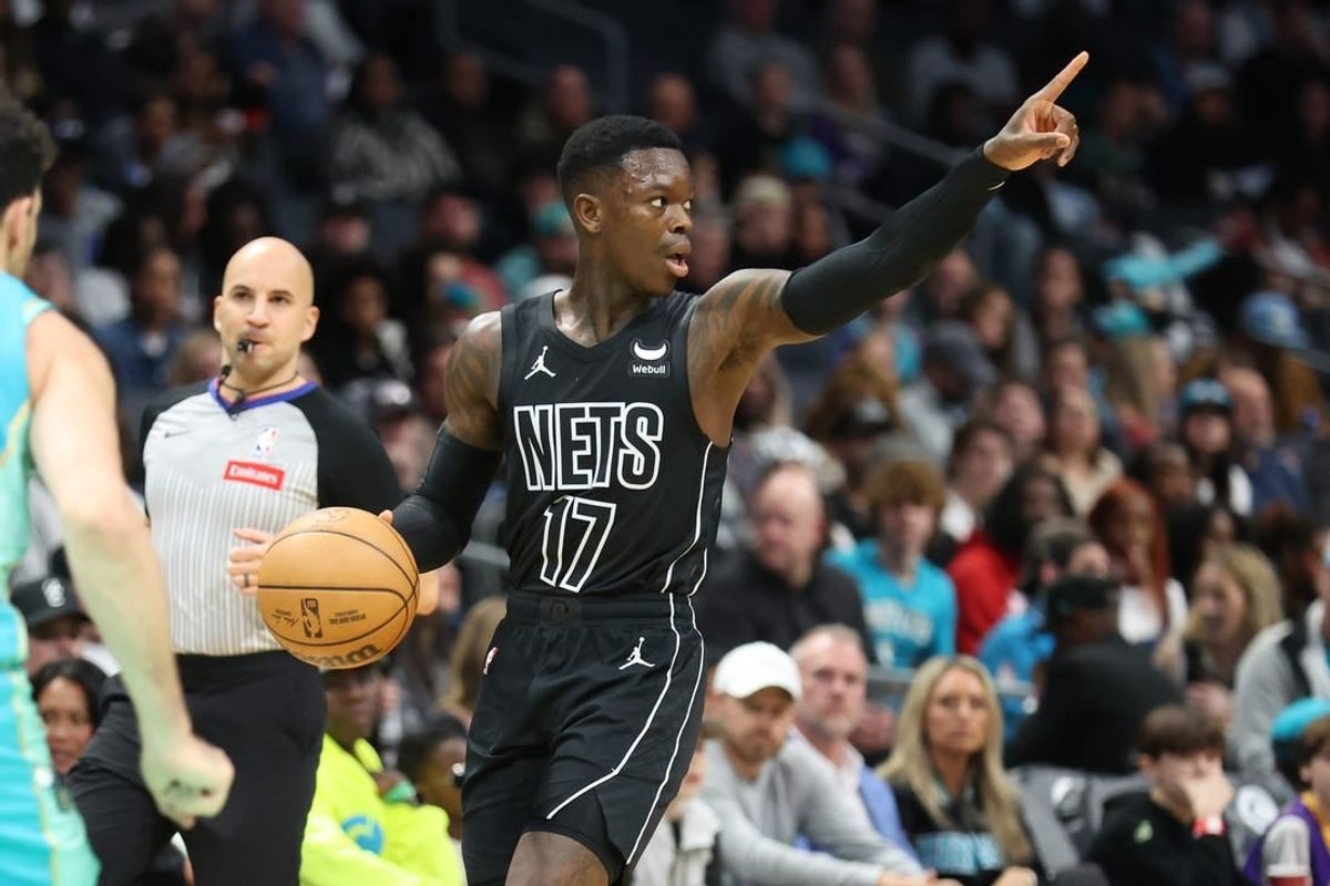 Mar 9, 2024; Charlotte, North Carolina, USA;  Brooklyn Nets guard Dennis Schroder (17) directs the play against the Charlotte Hornets during the first quarter at Spectrum Center.