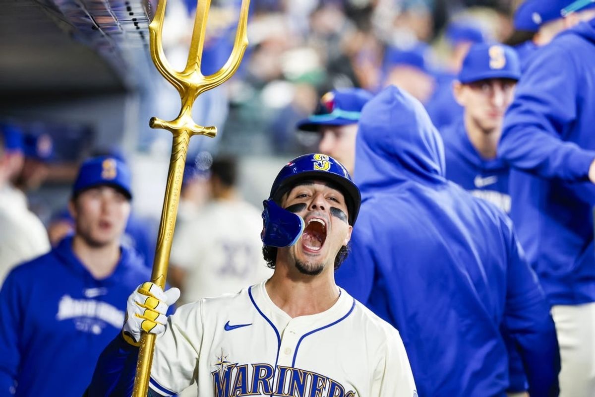 Apr 28, 2024; Seattle, Washington, USA; Seattle Mariners third baseman Josh Rojas (4) celebrates after hitting a lead-off home run against the Arizona Diamondbacks during the first inning at T-Mobile Park.