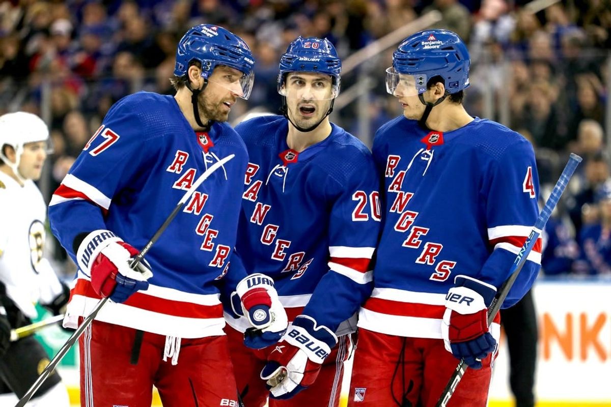 Nov 25, 2023; New York, New York, USA; New York Rangers left wing Chris Kreider (20) talks with right wing Blake Wheeler (17) and defenseman Braden Schneider (4) during the first period against the Boston Bruins at Madison Square Garden.