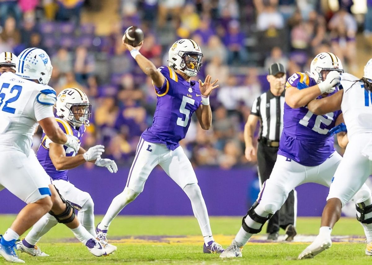 Quarterback Jayden Daniels 5 throws a pass as the LSU Tigers take on Georgia State in Tiger Stadium in Baton Rouge, Louisiana, November 18, 2023.