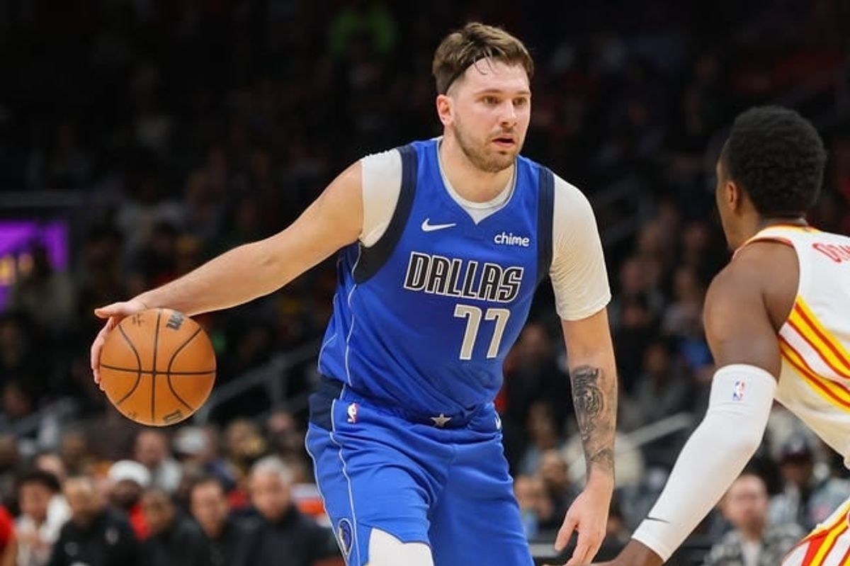 Jan 26, 2024; Atlanta, Georgia, USA; Dallas Mavericks guard Luka Doncic (77) dribbles against the Atlanta Hawks in the first quarter at State Farm Arena.