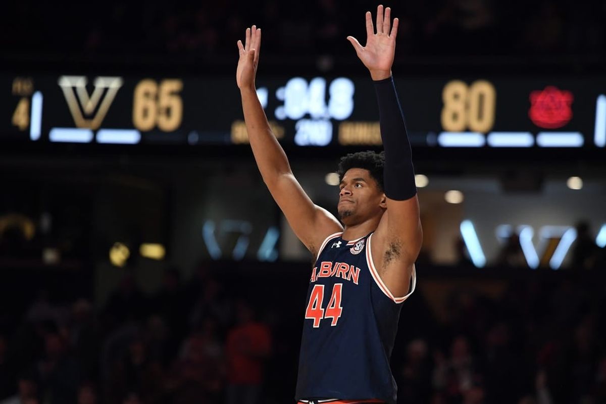 Jan 17, 2024; Nashville, Tennessee, USA; Auburn Tigers center Dylan Cardwell (44) celebrates in the closing seconds of the second half of a win against the Vanderbilt Commodores at Memorial Gymnasium.
