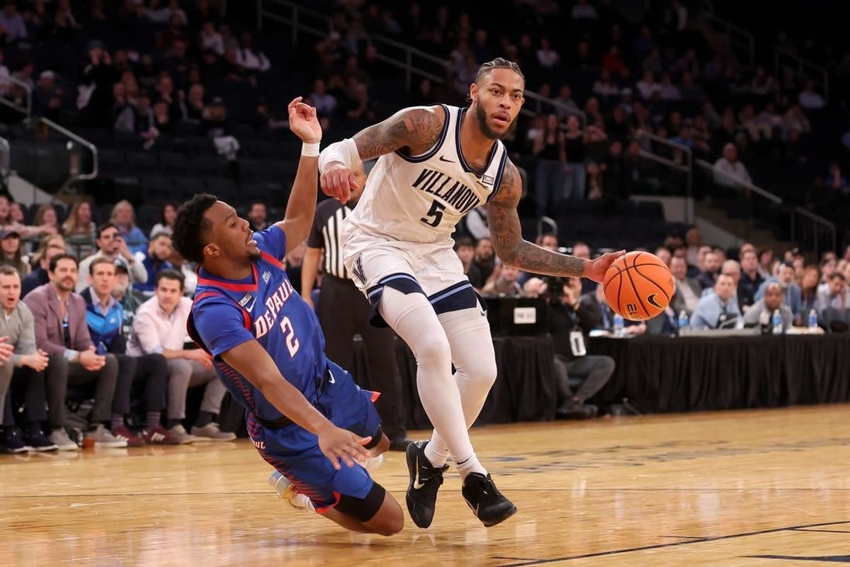 Mar 13, 2024; New York City, NY, USA; Villanova Wildcats guard Justin Moore (5) is fouled by DePaul Blue Demons guard Chico Carter Jr. (2) during the second half at Madison Square Garden.