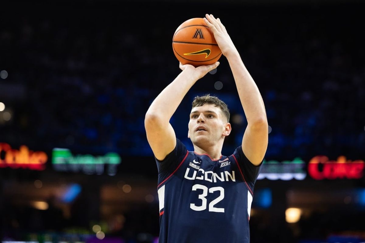Jan 20, 2024; Philadelphia, Pennsylvania, USA; Connecticut Huskies center Donovan Clingan (32) shoots the ball against the Villanova Wildcats during the first half at Wells Fargo Center.
