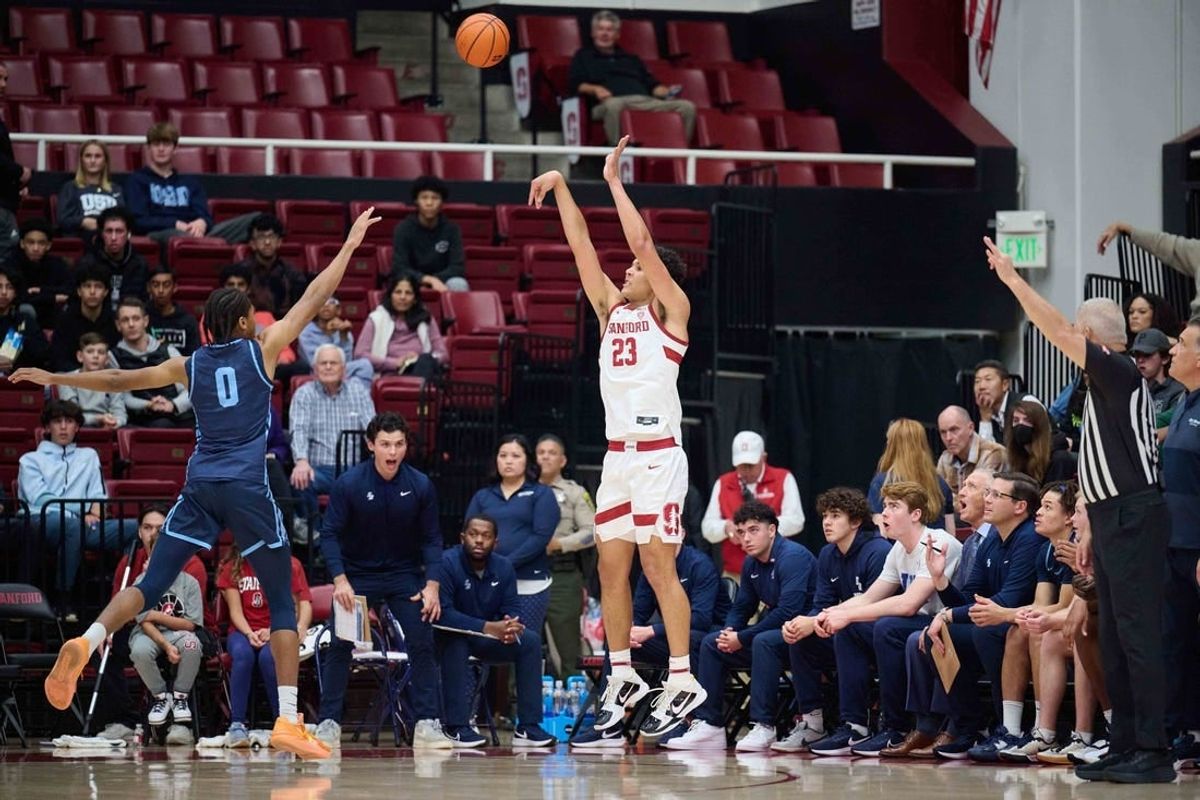 Dec 3, 2023; Stanford, California, USA; Stanford Cardinal forward Brandon Angel (23) shoots the ball against San Diego Toreros guard Kevin Patton Jr. (0) during the first half at Maples Pavilion.