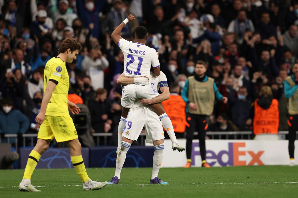 Rodrygo and Benzema celebrate a game-tying goal.