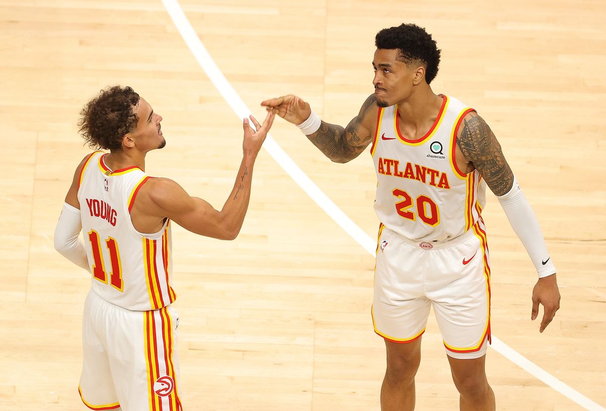 Trae Young and John Collins will continue to be teammates.