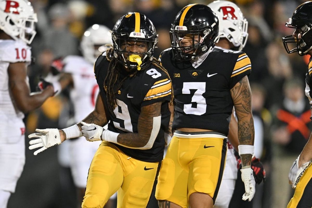 Nov 11, 2023; Iowa City, Iowa, USA; Iowa Hawkeyes running back Jaziun Patterson (9) and wide receiver Kaleb Brown (3) react after a touchdown by Patterson against the Rutgers Scarlet Knights during the fourth quarter at Kinnick Stadium.