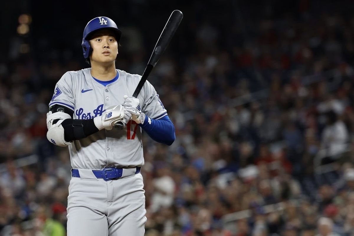 Apr 24, 2024; Washington, District of Columbia, USA; Los Angeles Dodgers designated hitter Shohei Ohtani (17) reacts after nearly being hit by a pitch against the Washington Nationals during the eighth inning at Nationals Park.