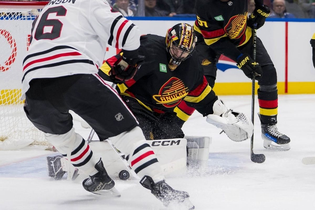 Jan 22, 2024; Vancouver, British Columbia, CAN; Vancouver Canucks goalie Thatcher Demko (35) makes a save on Chicago Blackhawks forward Jason Dickinson (16) in the second period at Rogers Arena.