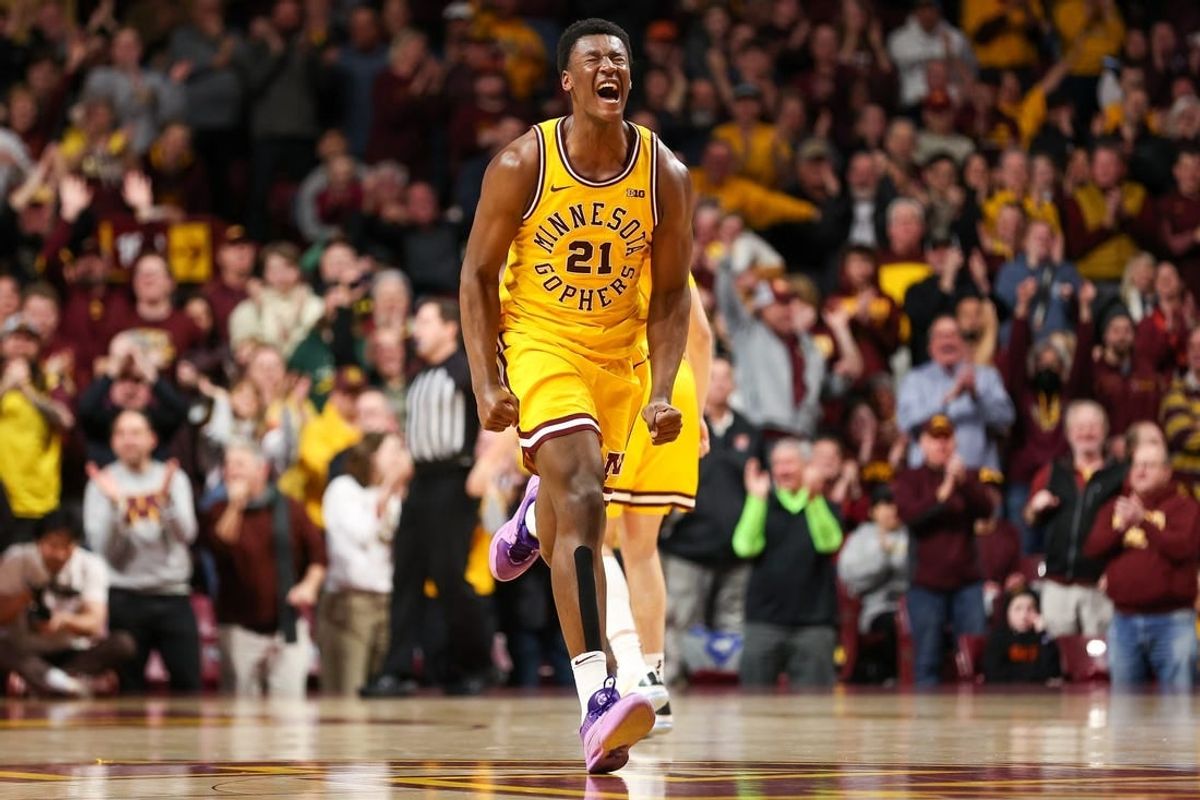 Feb 3, 2024; Minneapolis, Minnesota, USA; Minnesota Golden Gophers forward Pharrel Payne (21) celebrates his dunk against the Northwestern Wildcats during overtime at Williams Arena.
