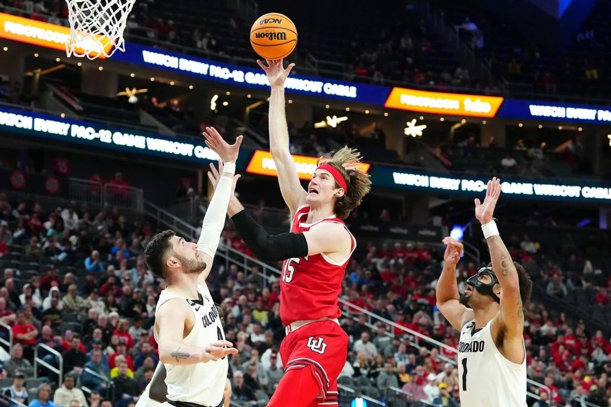 Mar 14, 2024; Las Vegas, NV, USA; Utah Utes center Branden Carlson (35) shoots between Colorado Buffaloes guard Luke O'Brien (0) and guard J'Vonne Hadley (1) during the second half at T-Mobile Arena.