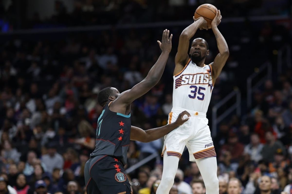 Feb 4, 2024; Washington, District of Columbia, USA; Phoenix Suns forward Kevin Durant (35) shoots the ball over Washington Wizards guard Bilal Coulibaly (0) in the first half at Capital One Arena.